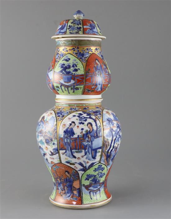 A large Chinese clobbered blue and white double gourd vase and cover, Kangxi period, H.42.5cm, cover repaired, crack to neck